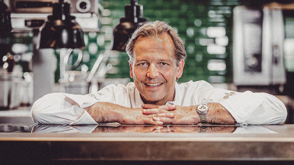 Portrait of the chef of the restaurant Dichterin a white jacket at the counter